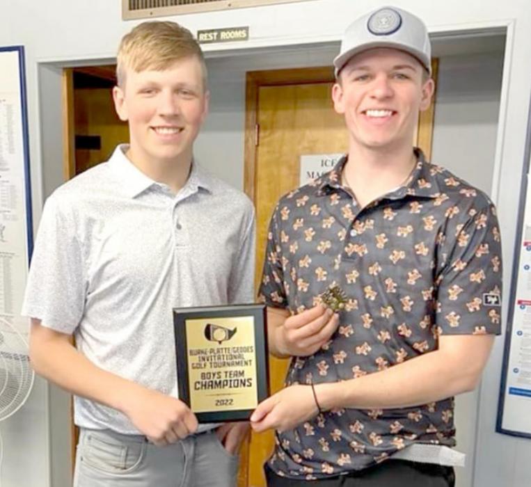 Kade Braun, l, and Coy Determan, r, hold the championship plaque the team earned at the Burke-Platte Golf Tournament.