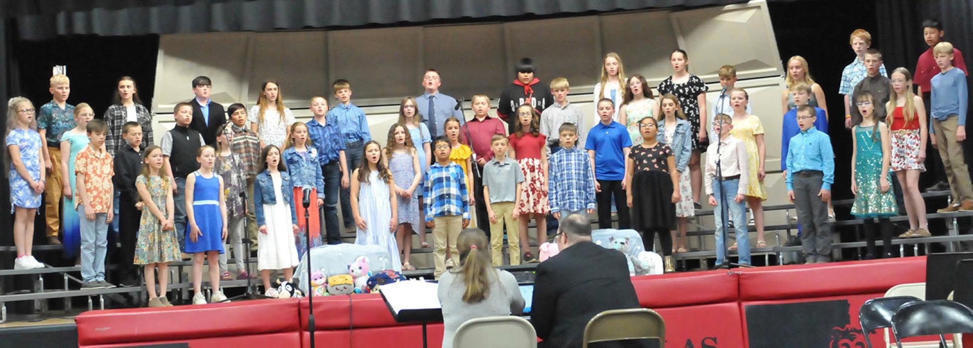 Students in fourth and fifth grades wore more conventional concert apparel to sing “Dare to Have a Dream” and “Unsung Heroes,” both by Karl Hitzemann.