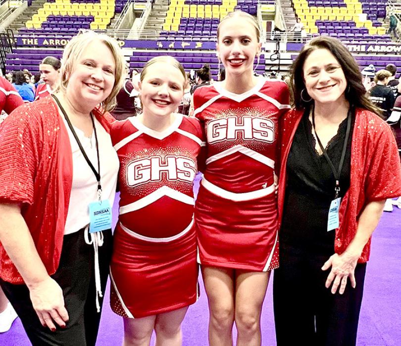 Coaches Lenna Braun, far left, and Jenny Hansen, far right, are shown here with the team’s two seniors, Madi Graber, center l, and Addy Stukel, center r.