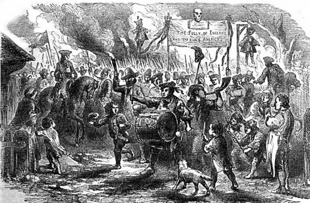 “The Stamp Act Riots at Boston, in America” from Cassell’s Illustrated History of England, Volume 5 shows the effigy of Andrew Oliver hanging in the background as the crowd riots over the Stamp Act. (In the public domain)